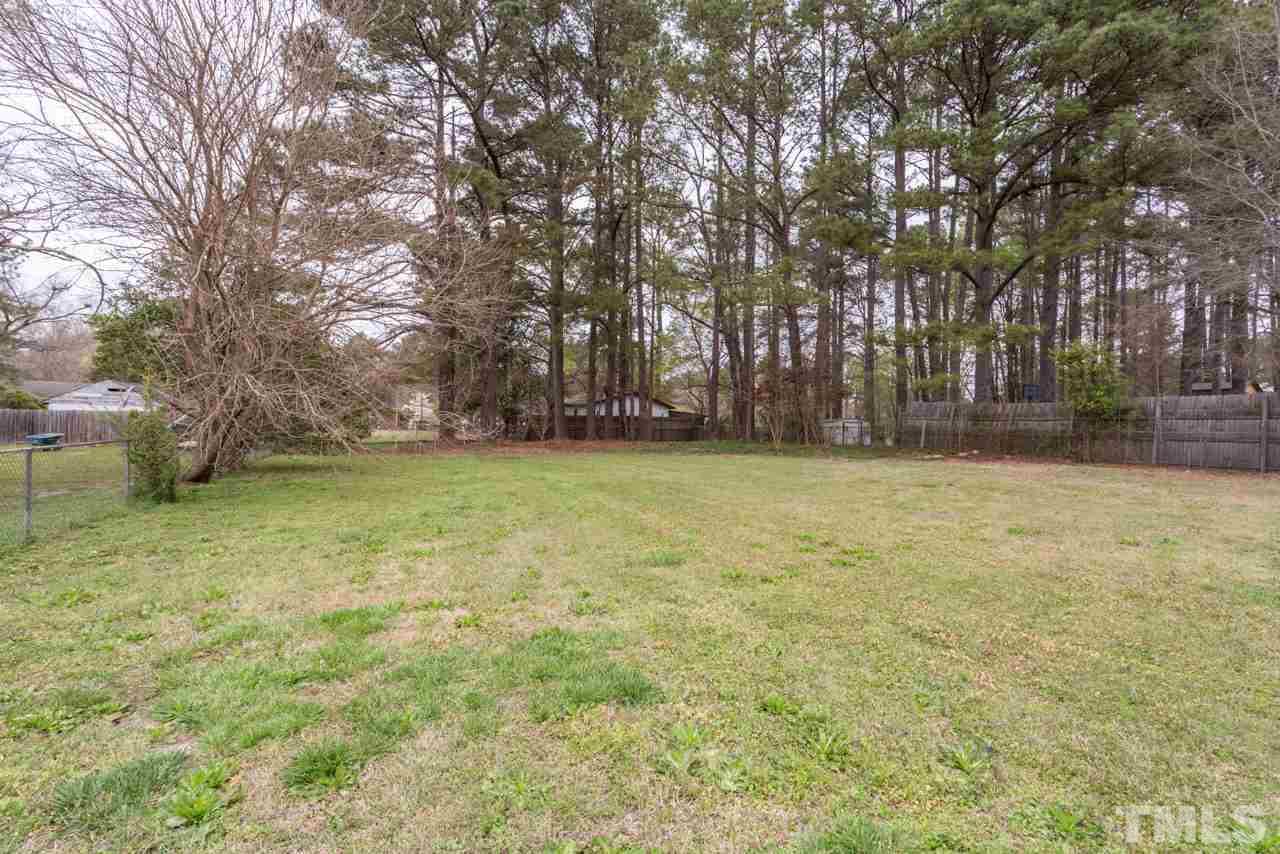 3822 Corwin Road Garner, NC 27529 - Photo 23 of 25 a view of a yard with a trees