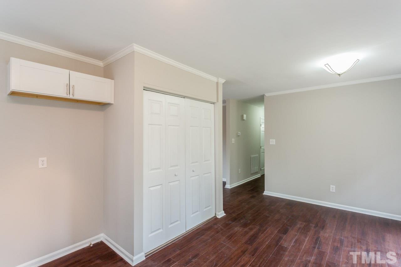 3822 Corwin Road Garner, NC 27529 - Photo 8 of 25 a view of an empty room with wooden floor