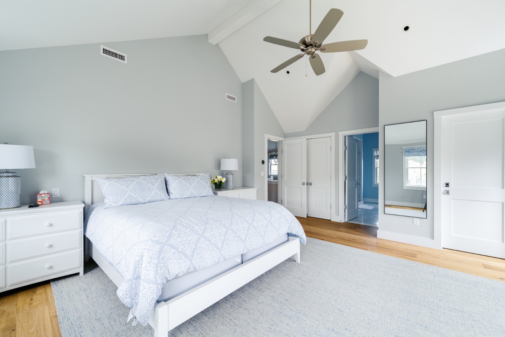 86 Cliff Road Nantucket, MA 02554 - Photo 15 of 29 a spacious bedroom with a bed and a ceiling fan