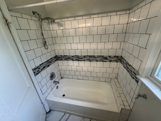 10117 South Perry Avenue Chicago, IL 60628 - Photo 14 of 33 a bathroom with a bathtub