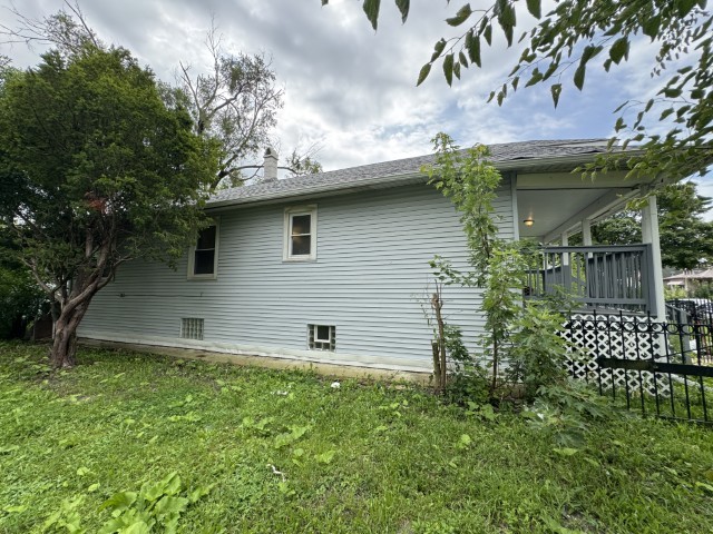 10117 South Perry Avenue Chicago, IL 60628 - Photo 3 of 33 a backyard of a house with lots of green space