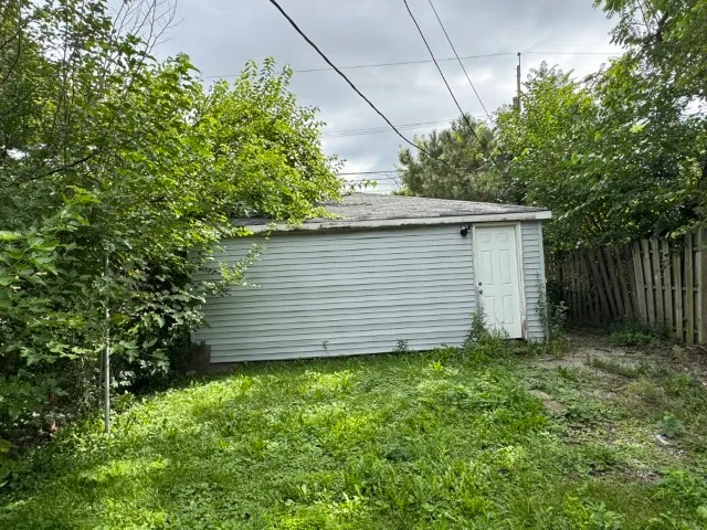 a view of a backyard of the house