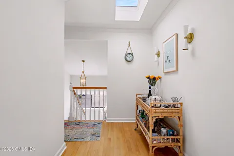 a view of an entryway with wooden floor