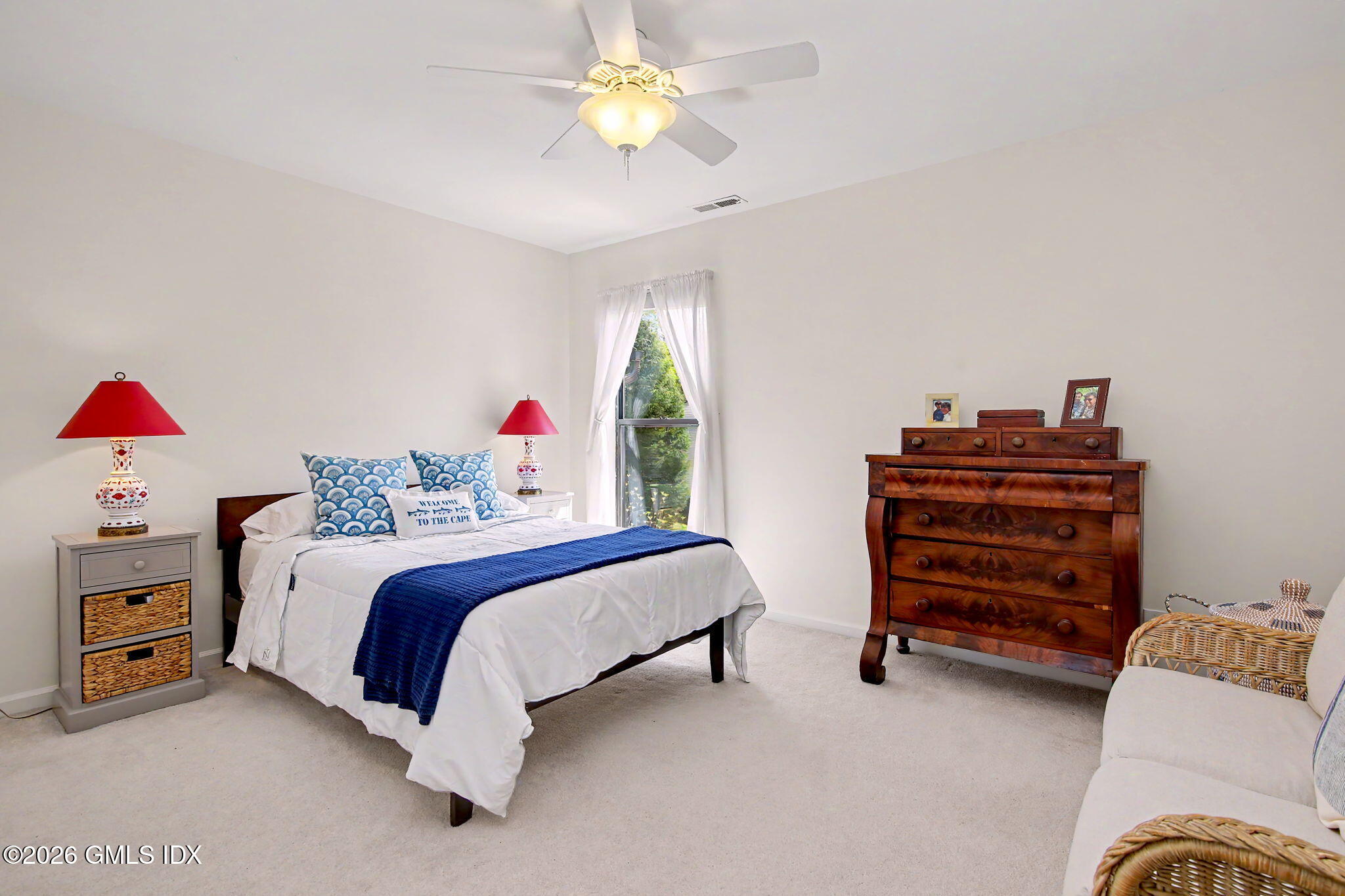 500 River Road, Unit 3 Cos Cob, CT 06807 - Photo 11 of 21 a bedroom with a bed and a chandelier