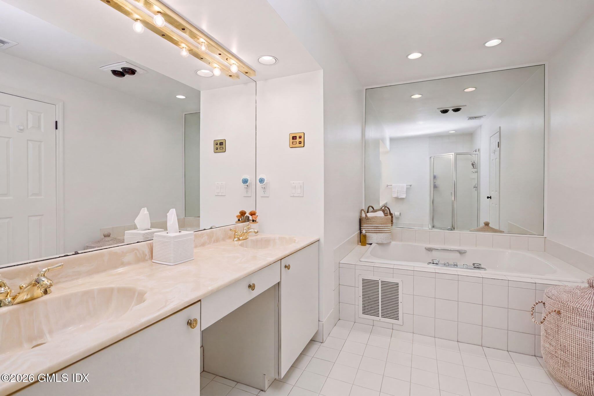 500 River Road, Unit 3 Cos Cob, CT 06807 - Photo 14 of 21 a bathroom with a sink double vanity and a mirror