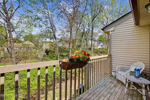 a view of a balcony with wooden floor