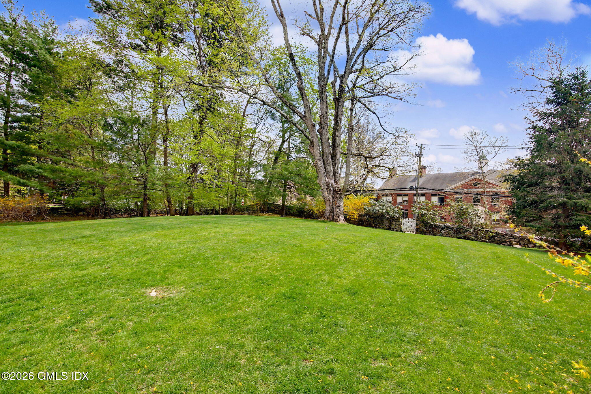 500 River Road, Unit 3 Cos Cob, CT 06807 - Photo 18 of 21 a view of a field of grass and trees