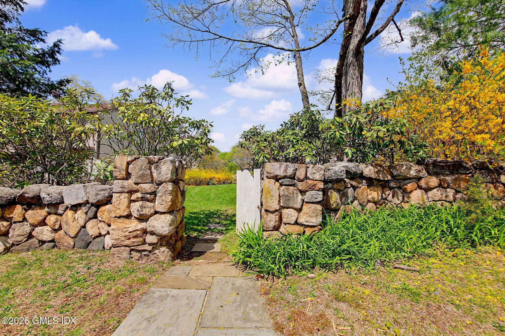 500 River Road, Unit 3 Cos Cob, CT 06807 - Photo 19 of 21 a view of a yard with plants and large trees