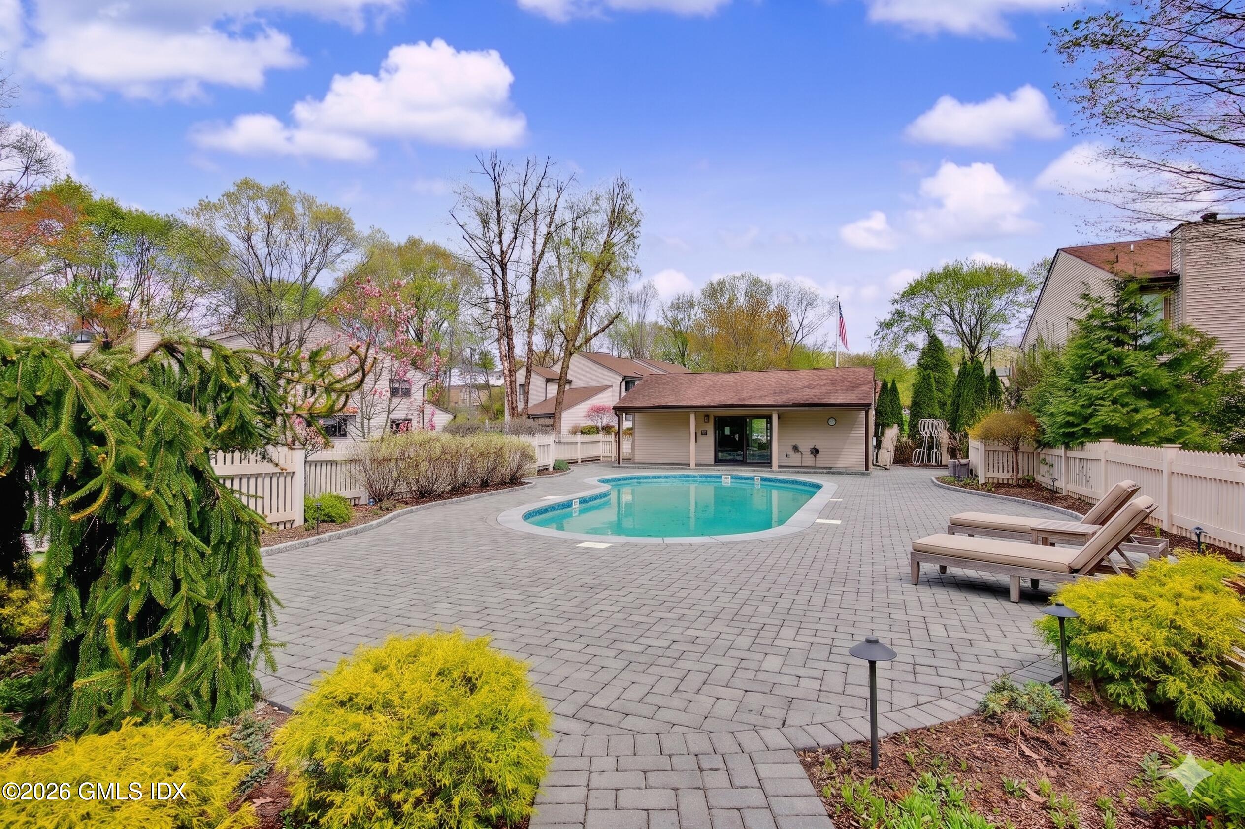 500 River Road, Unit 3 Cos Cob, CT 06807 - Photo 20 of 21 a front view of a house with garden