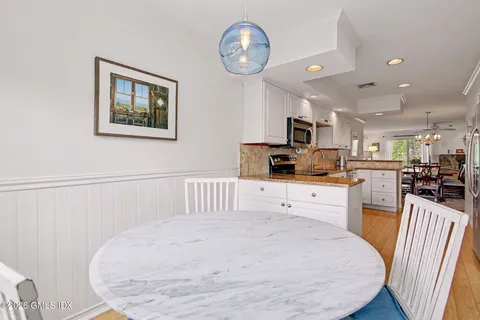 a kitchen with a appliances cabinets and a counter top space