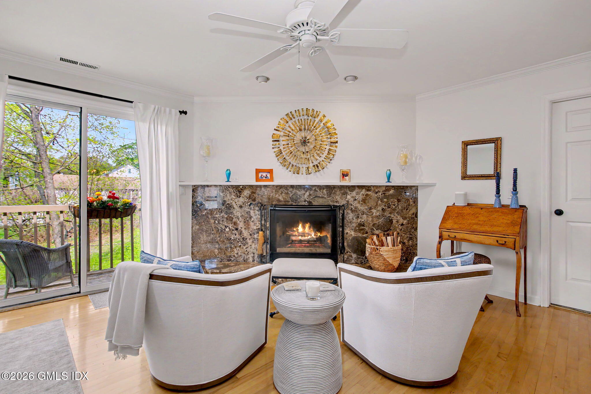 500 River Road, Unit 3 Cos Cob, CT 06807 - Photo 7 of 21 a living room with furniture and a fireplace