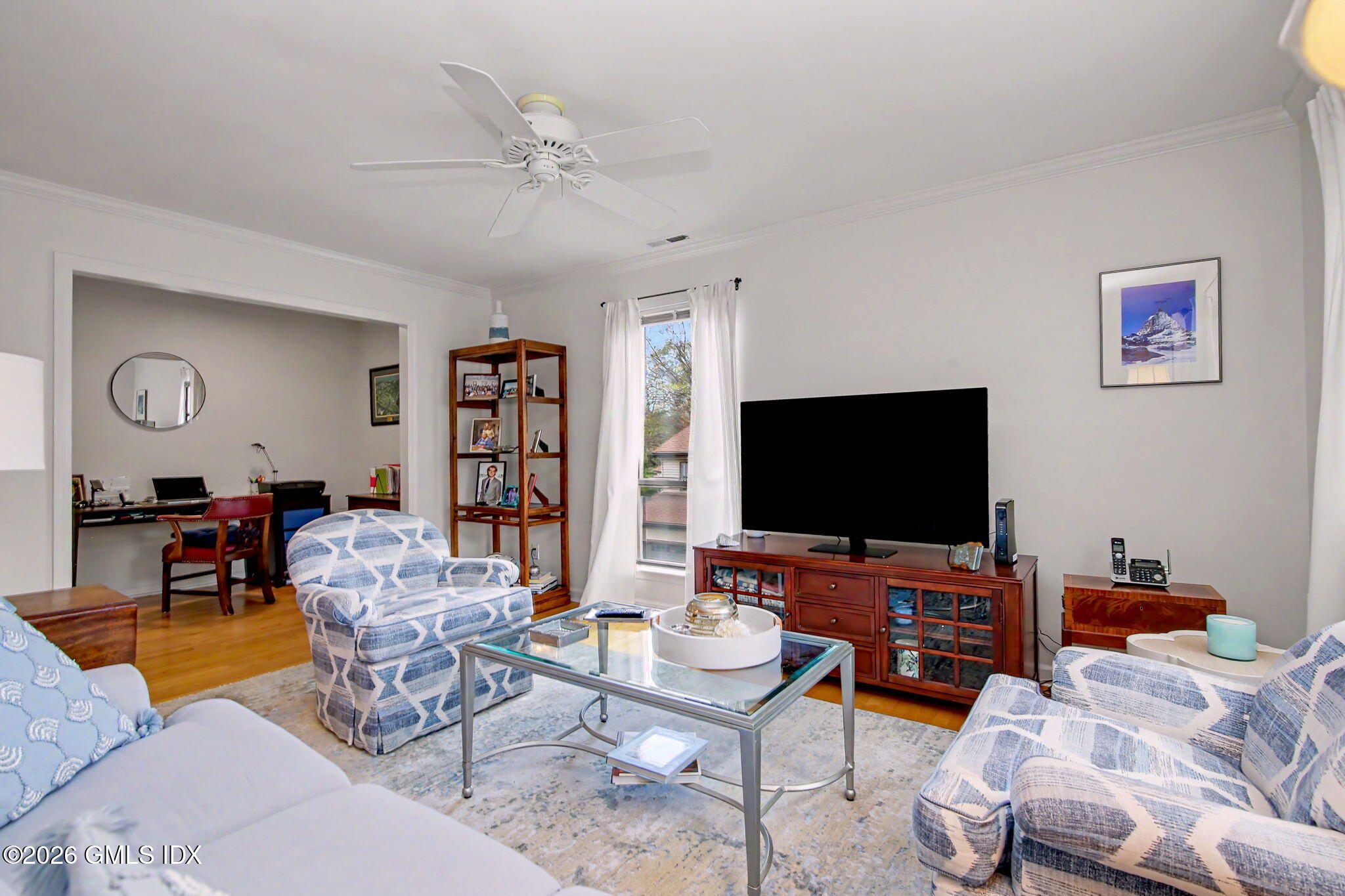 500 River Road, Unit 3 Cos Cob, CT 06807 - Photo 9 of 21 a living room with furniture and a flat screen tv