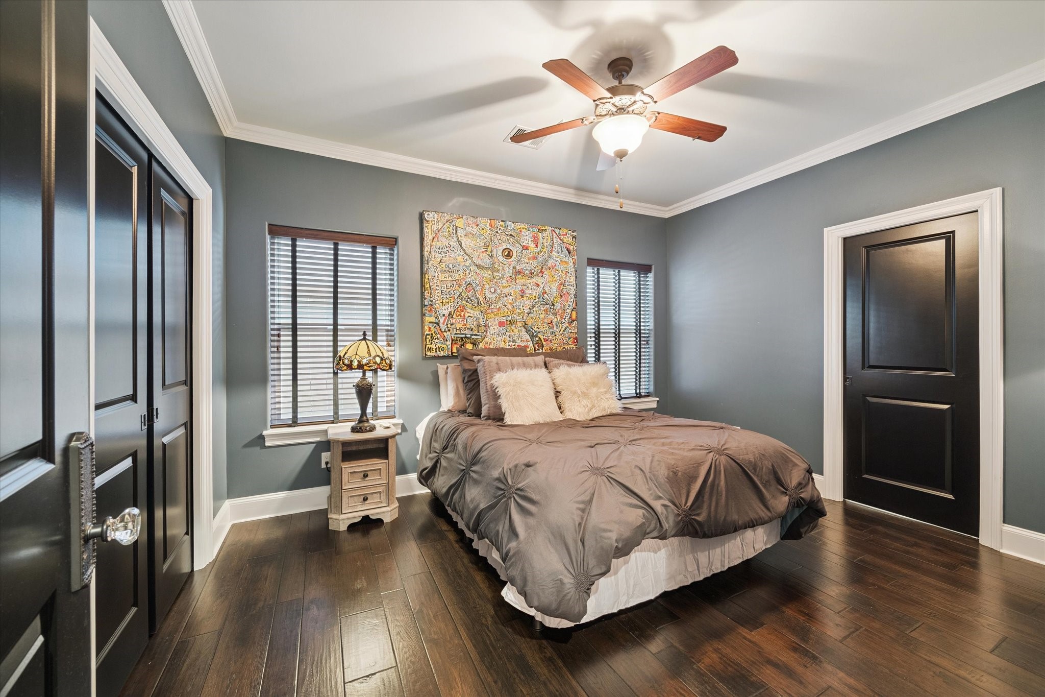 205 West 24th Street Houston, TX 77008 - Photo 15 of 32 a bedroom with a bed and a large window with wooden floor