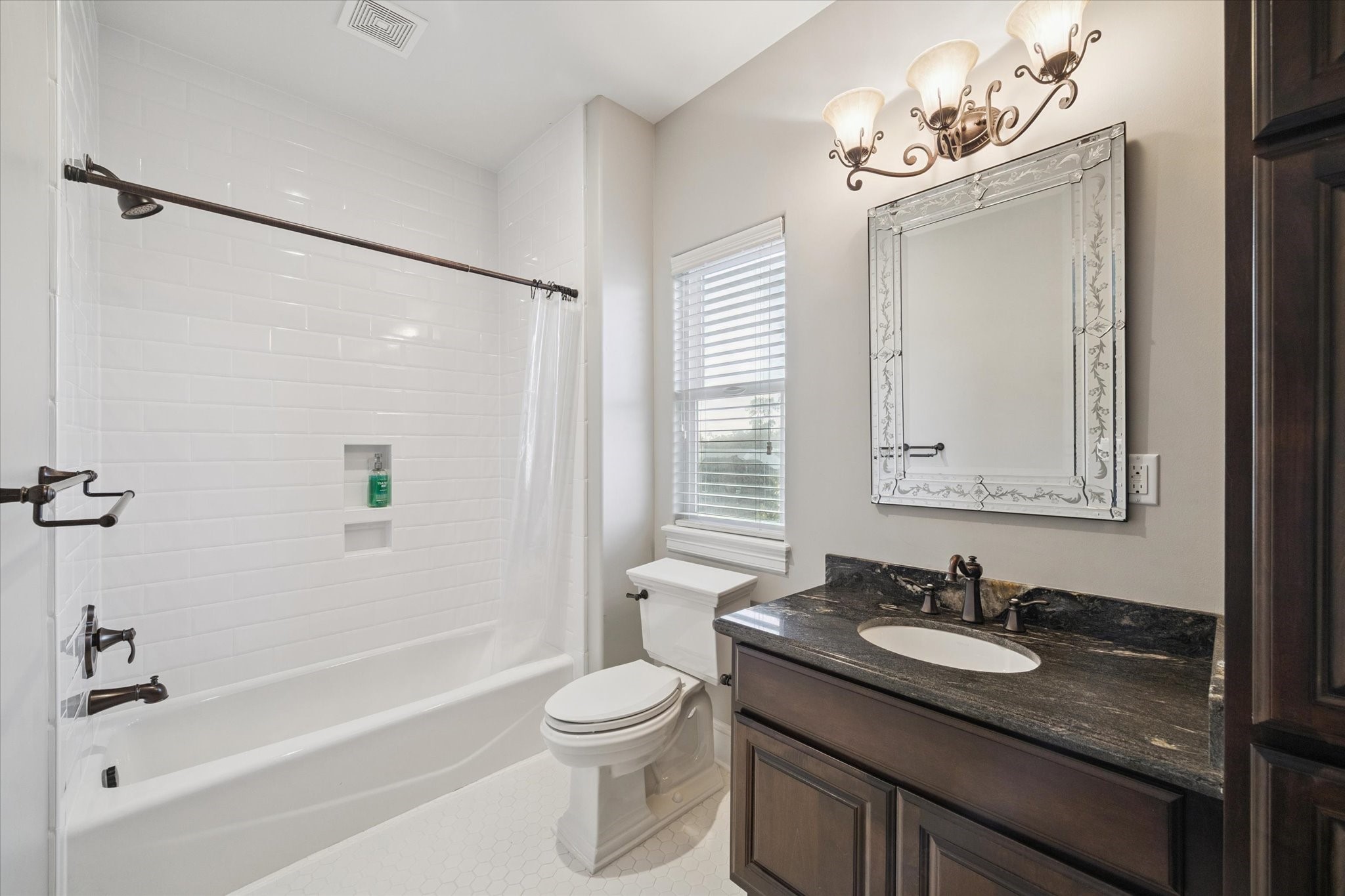 205 West 24th Street Houston, TX 77008 - Photo 22 of 32 a bathroom with a granite countertop sink toilet and shower