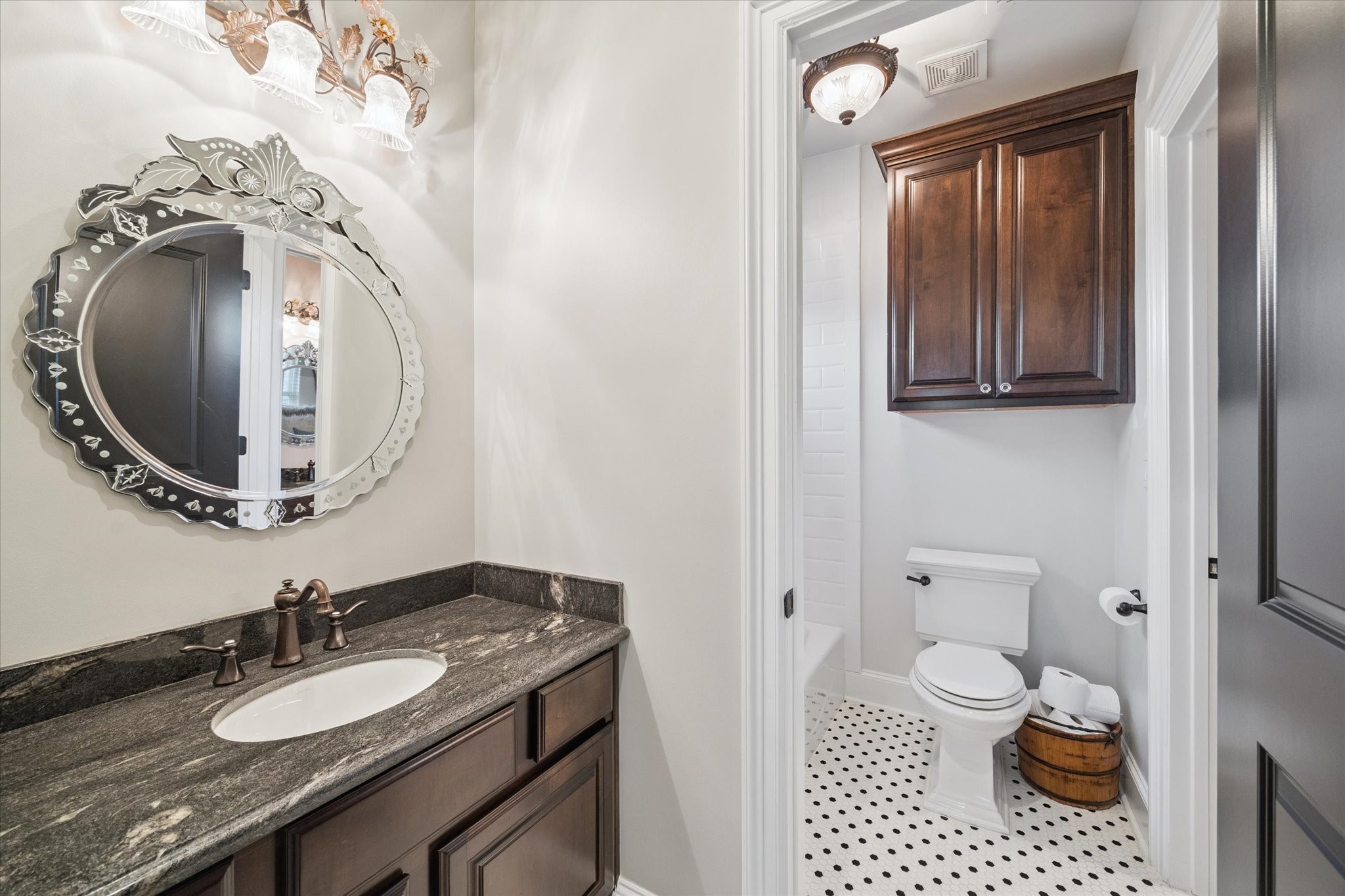 205 West 24th Street Houston, TX 77008 - Photo 25 of 32 a bathroom with a granite countertop sink and a mirror