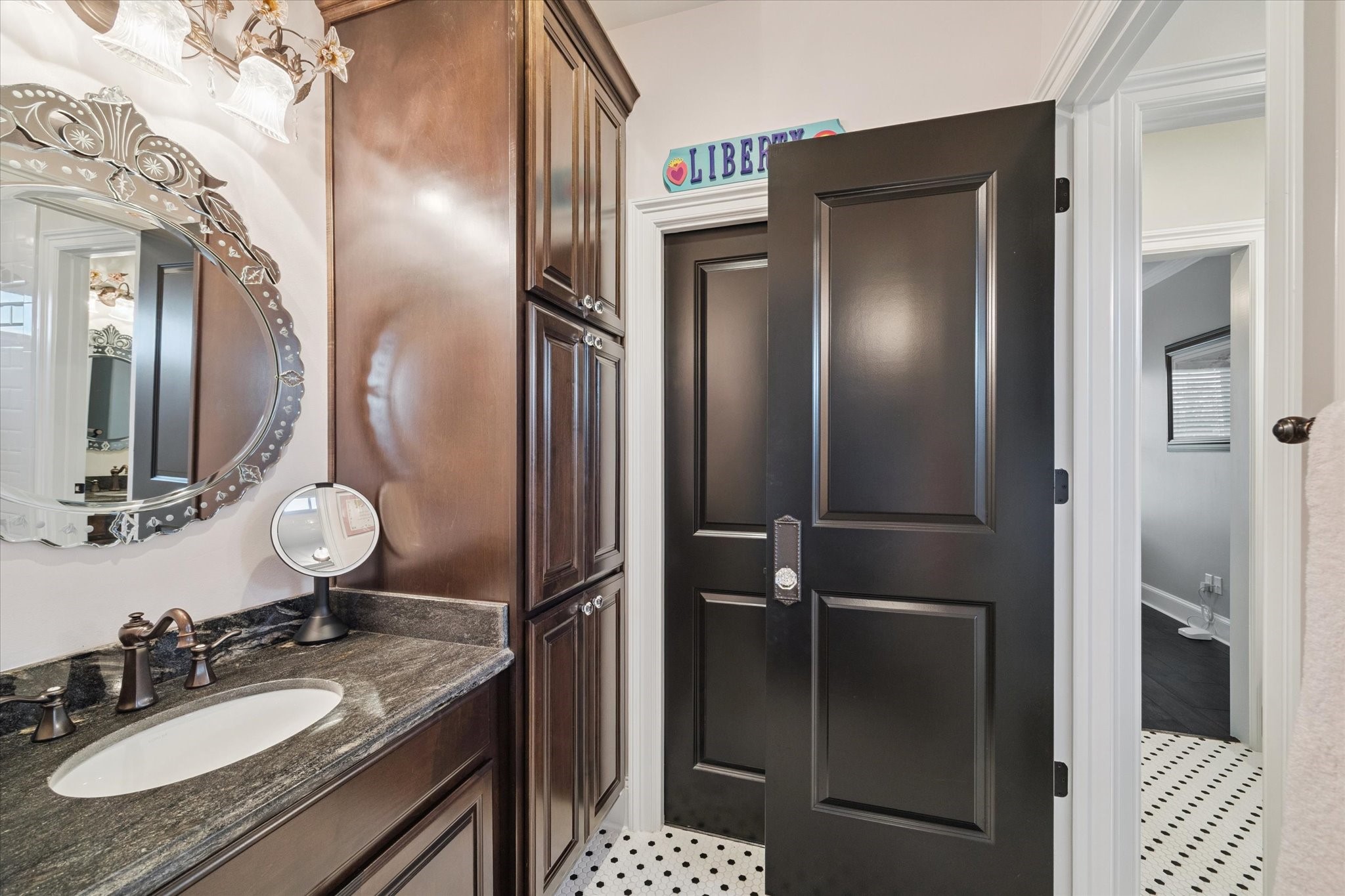 205 West 24th Street Houston, TX 77008 - Photo 26 of 32 a bathroom with a sink vanity granite shower and a mirror