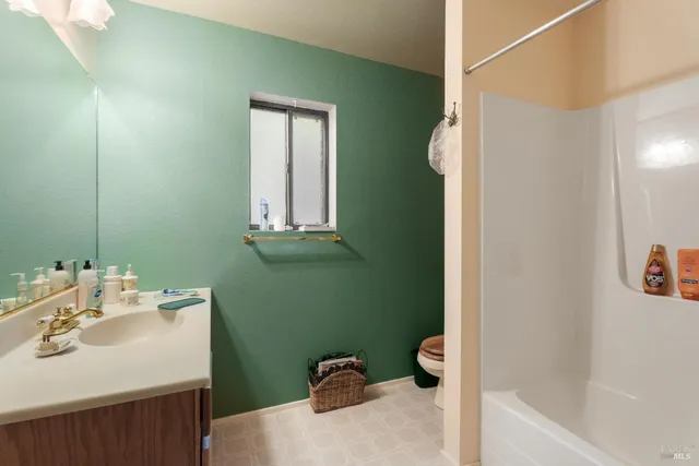 a bathroom with a sink toilet and tub