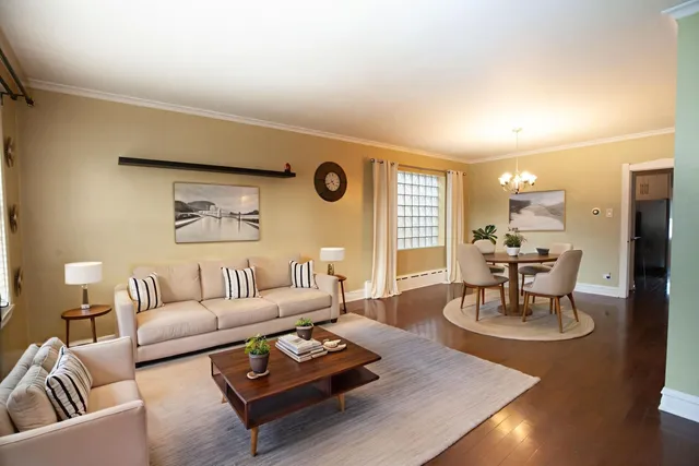 a living room with furniture and a table