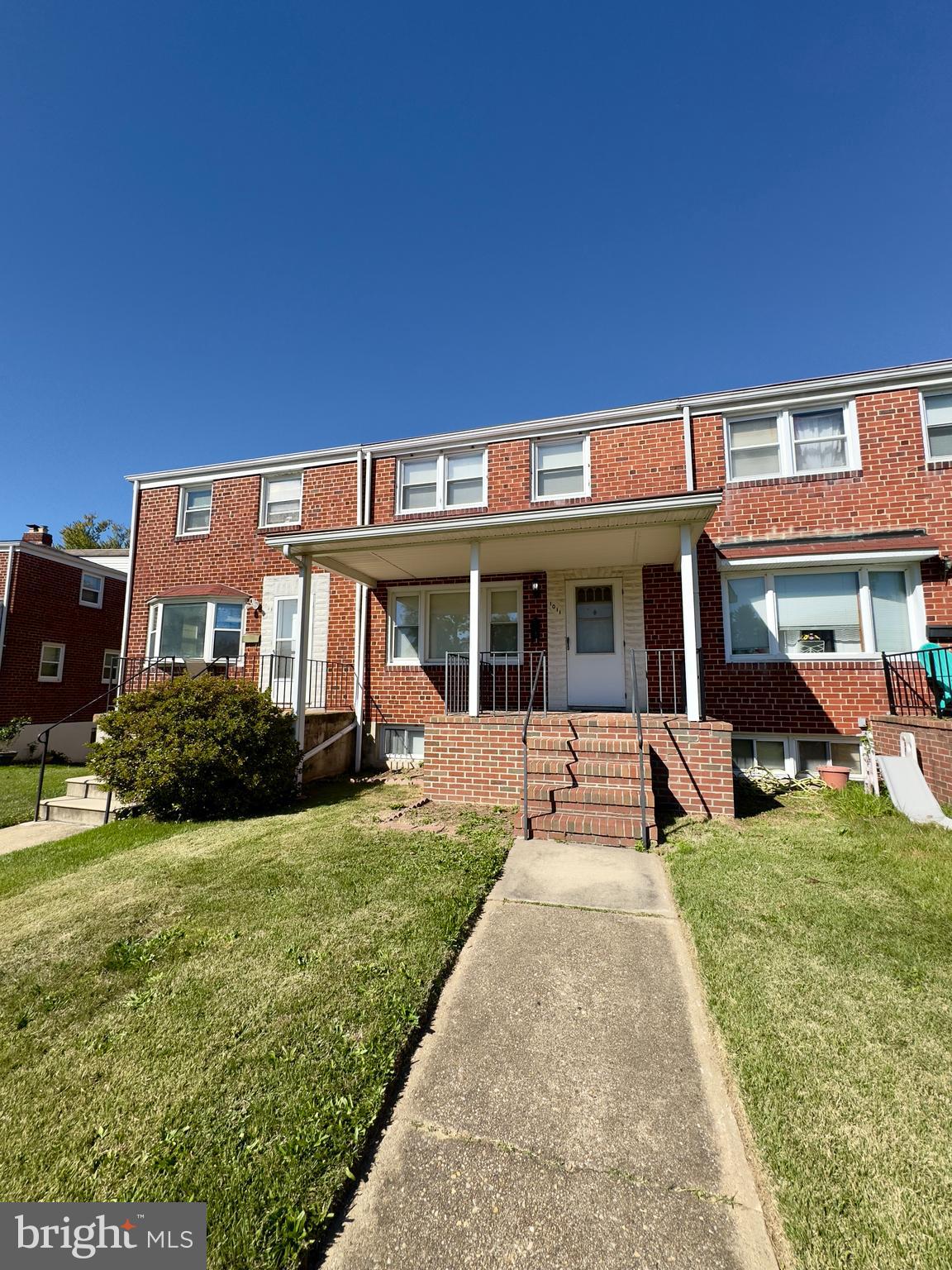 1011 Linden Avenue Baltimore, MD 21227 - Photo 1 of 20 a view of a house with swimming pool and a yard
