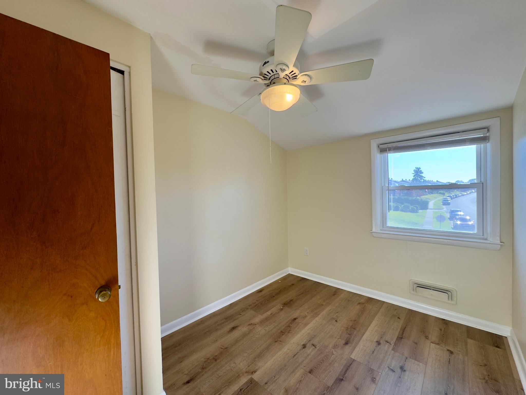 1011 Linden Avenue Baltimore, MD 21227 - Photo 19 of 20 wooden floor in an empty room