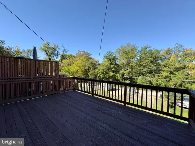 a balcony with wooden floor