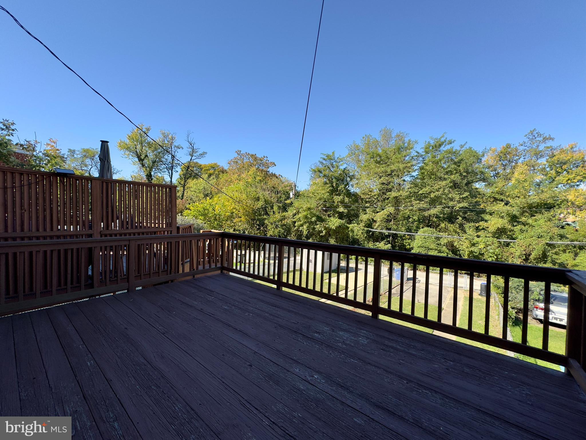 1011 Linden Avenue Baltimore, MD 21227 - Photo 10 of 20 a balcony with wooden floor