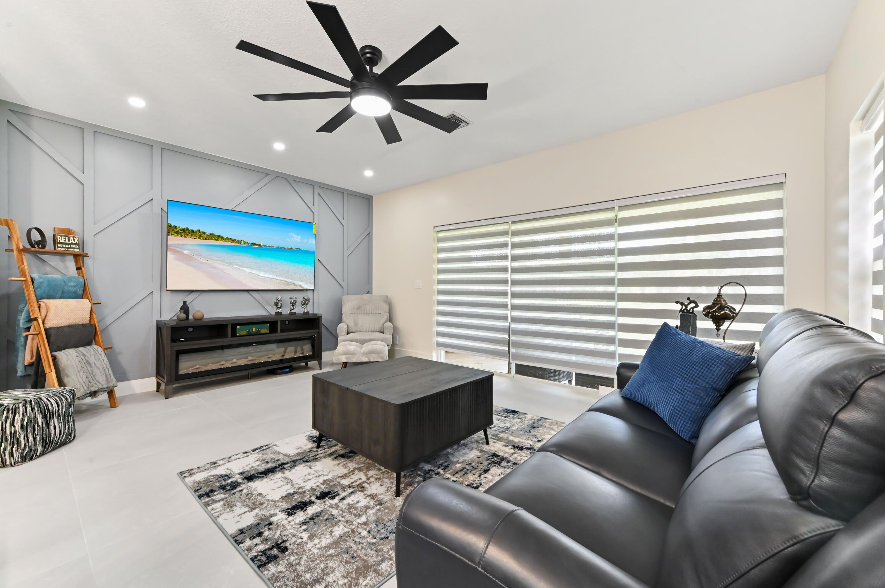 6880 Brook Hollow Road Lake Worth, FL 33467 - Photo 13 of 31 a living room with furniture and a flat screen tv