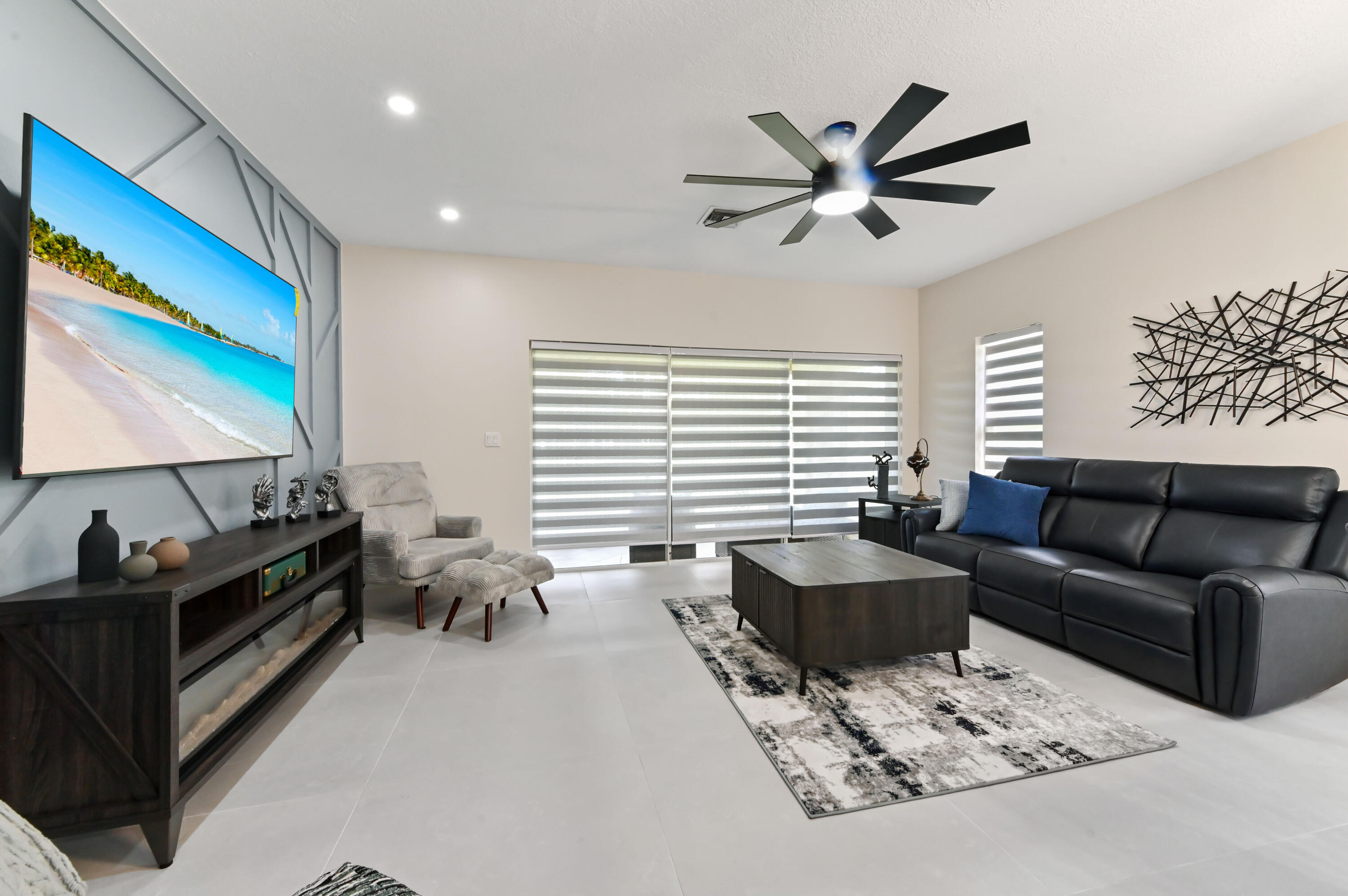 6880 Brook Hollow Road Lake Worth, FL 33467 - Photo 14 of 31 a living room with furniture and a flat screen tv