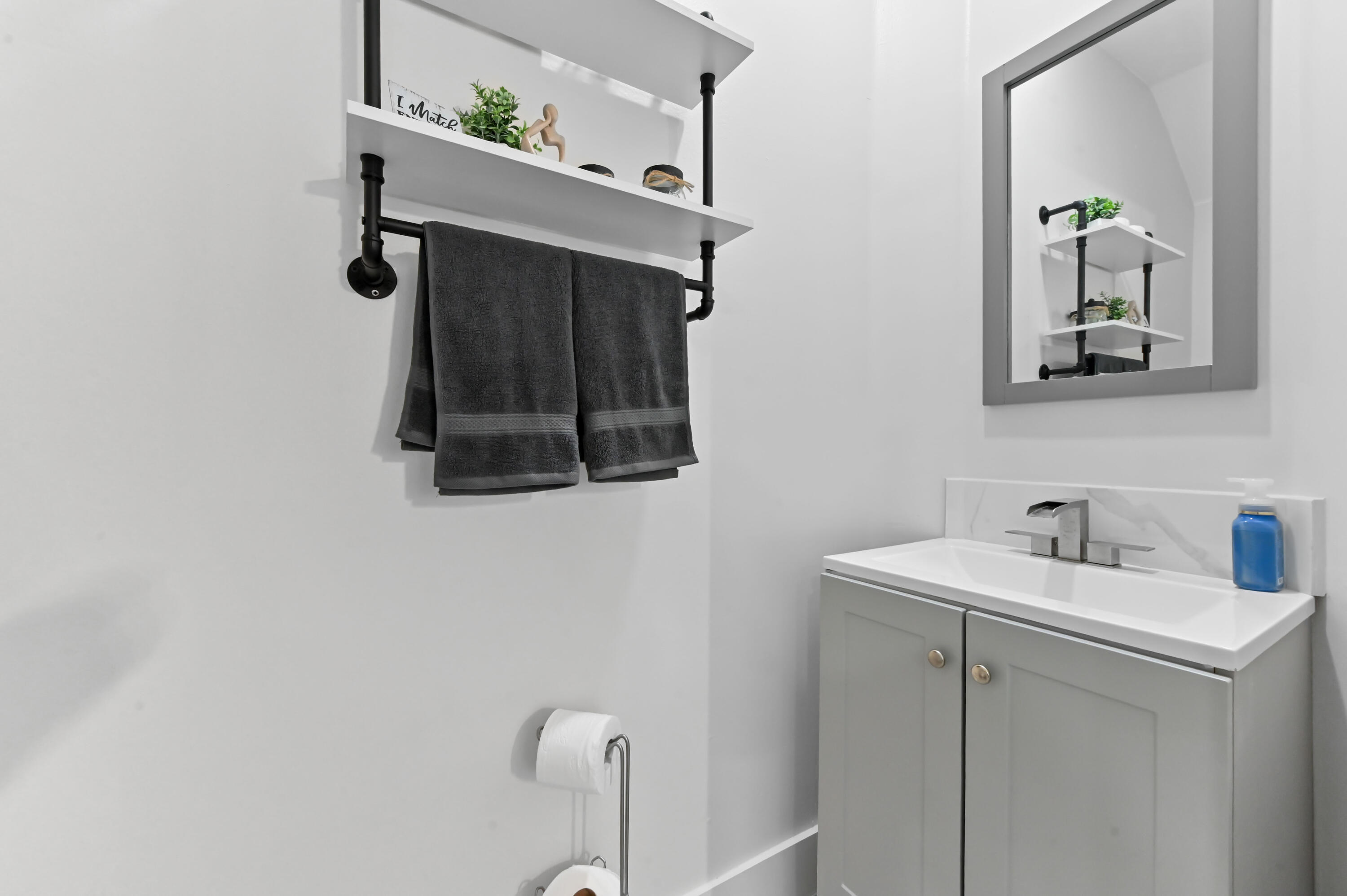 6880 Brook Hollow Road Lake Worth, FL 33467 - Photo 15 of 31 a bathroom with a sink and mirror