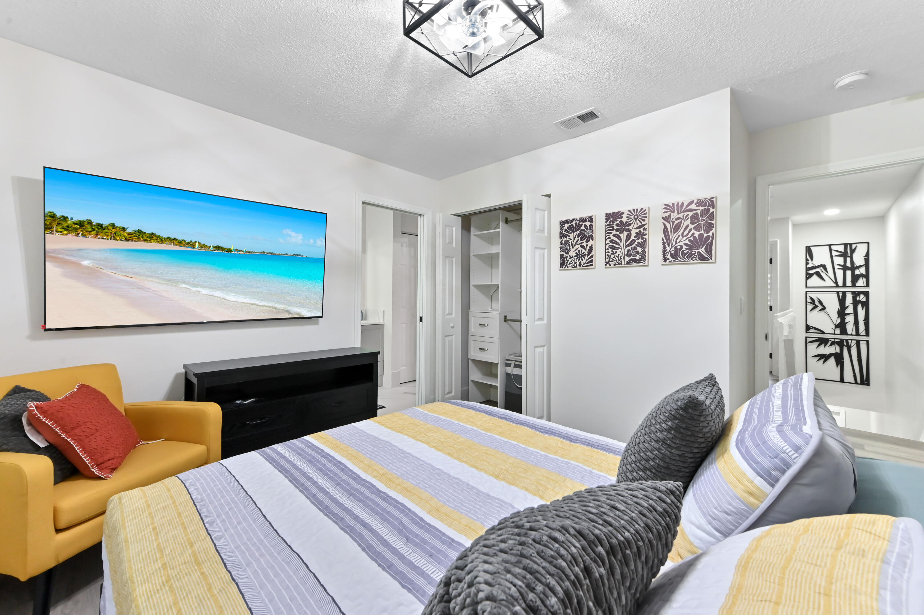 6880 Brook Hollow Road Lake Worth, FL 33467 - Photo 18 of 31 a bedroom with a bed couch and dresser