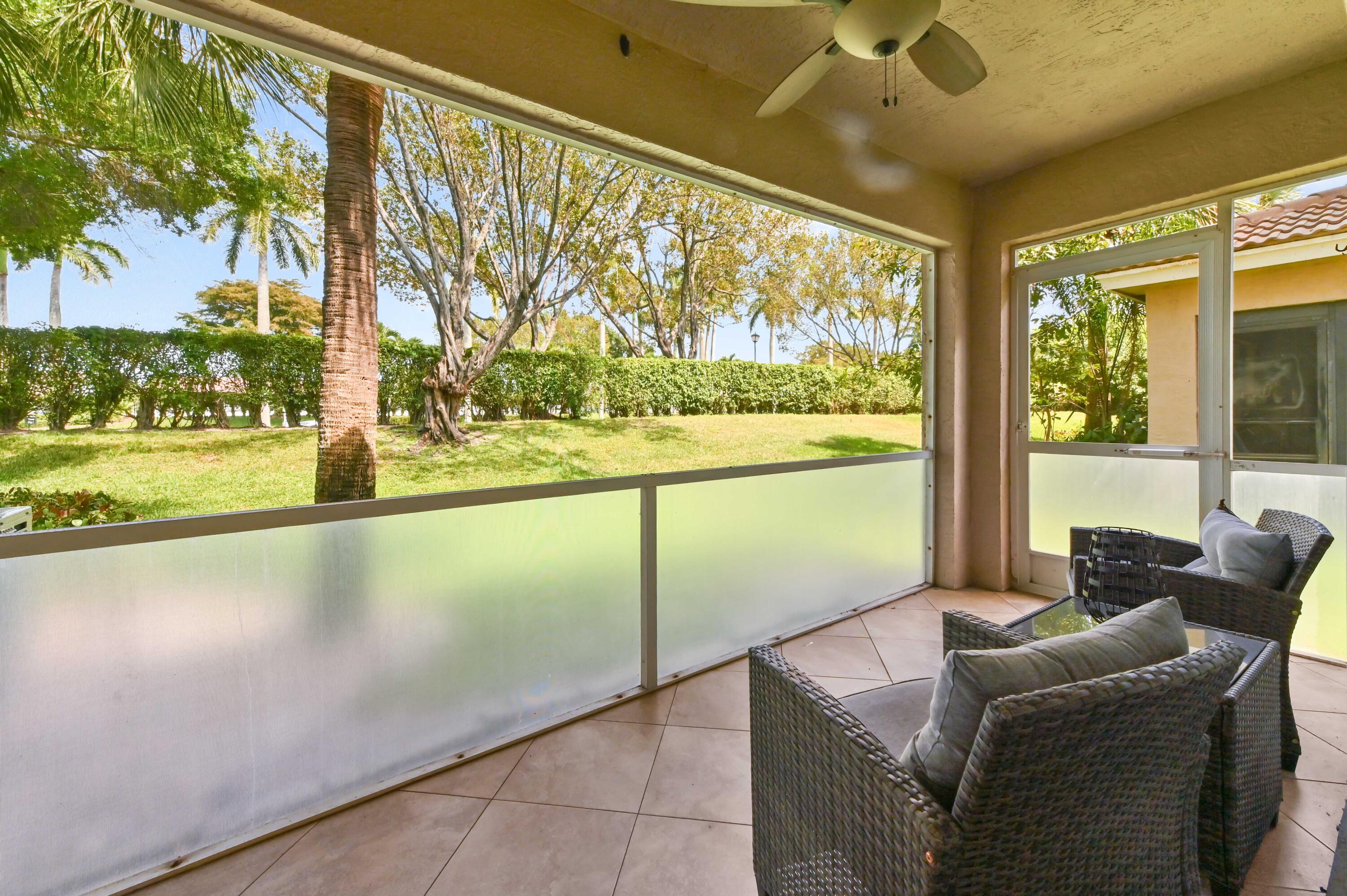 6880 Brook Hollow Road Lake Worth, FL 33467 - Photo 28 of 31 a living room with furniture and a large window
