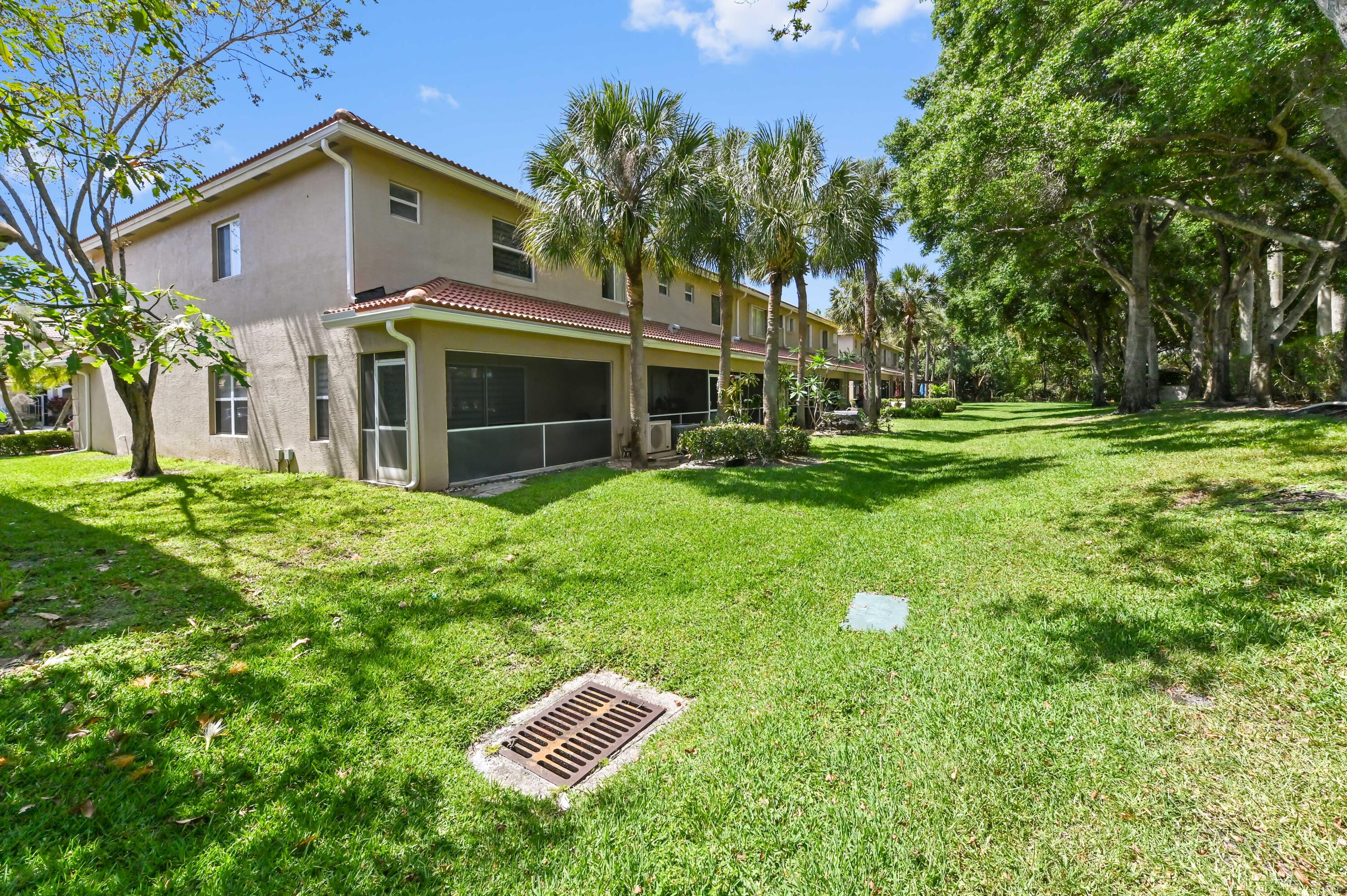 6880 Brook Hollow Road Lake Worth, FL 33467 - Photo 30 of 31 a view of a house with a backyard