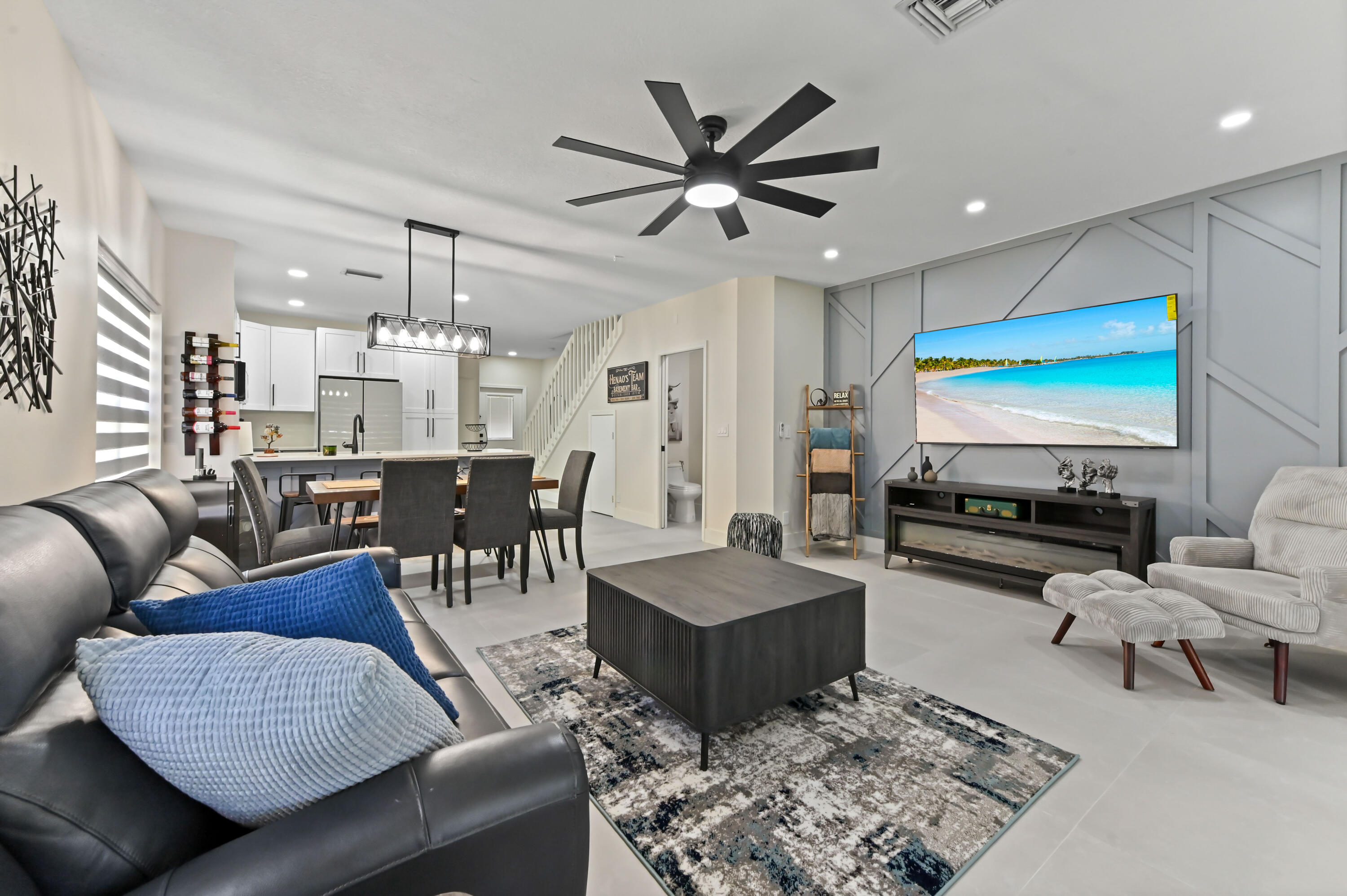 6880 Brook Hollow Road Lake Worth, FL 33467 - Photo 5 of 31 a living room with furniture kitchen view and a chandelier