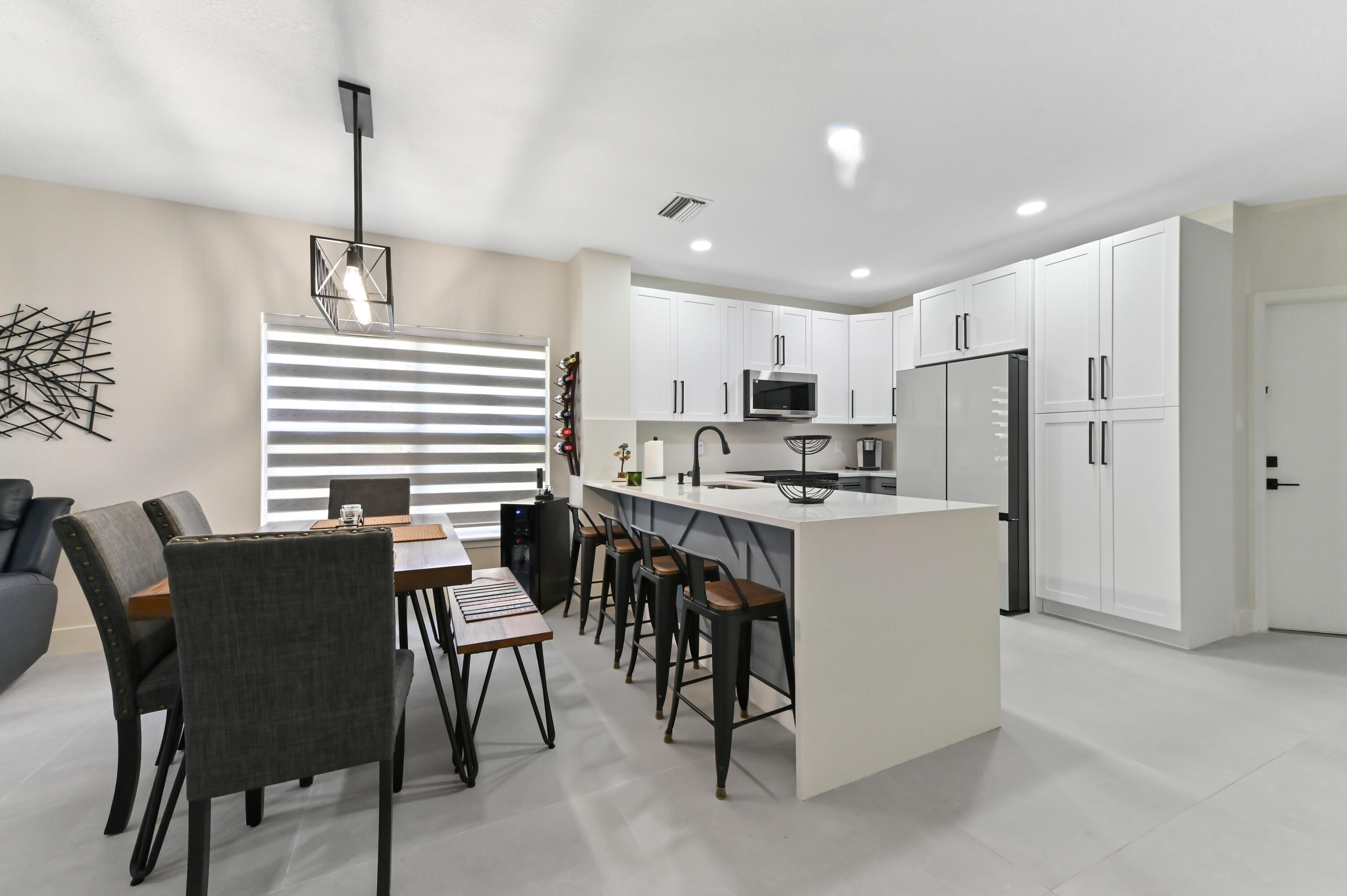 6880 Brook Hollow Road Lake Worth, FL 33467 - Photo 8 of 31 a kitchen with appliances cabinets and furniture