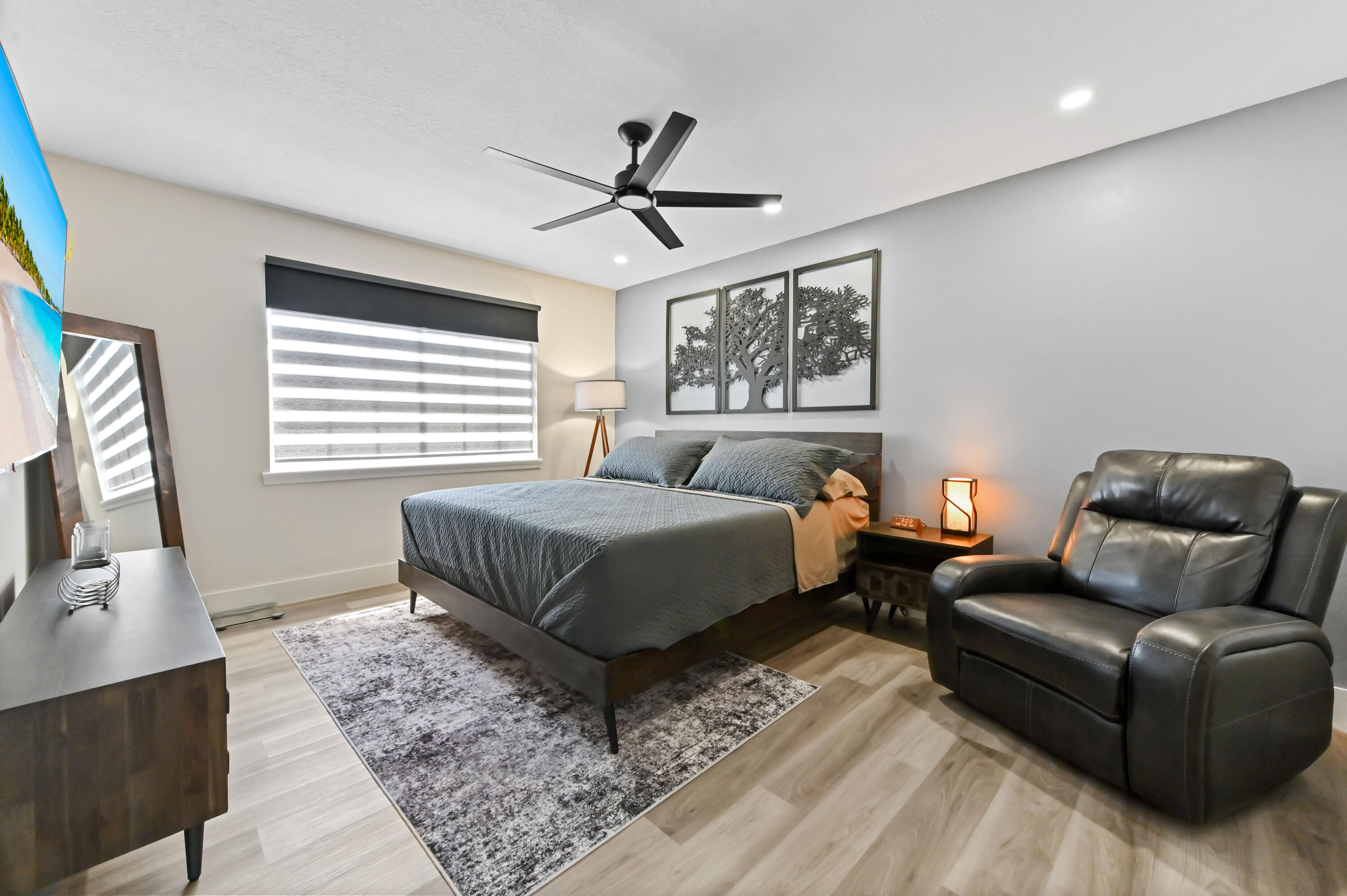 6880 Brook Hollow Road Lake Worth, FL 33467 - Photo 9 of 31 a bedroom with a bed couch and window