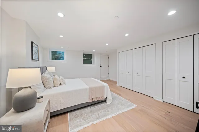 a bedroom with a bed and a couch