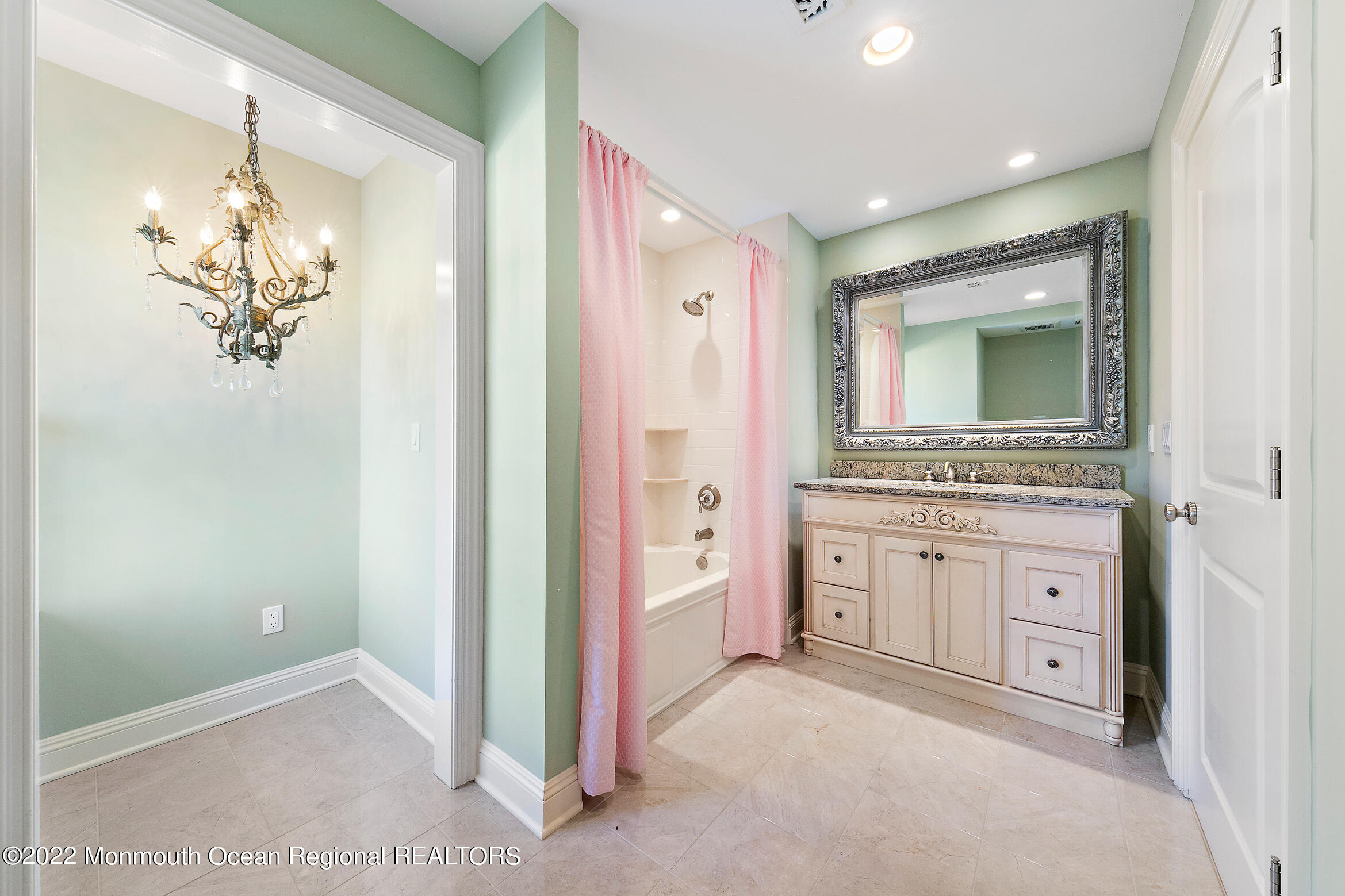 6 Eagle Nest Road Colts Neck, NJ 07722 - Photo 23 of 36 a spacious bathroom with a granite countertop sink a mirror and a bathtub