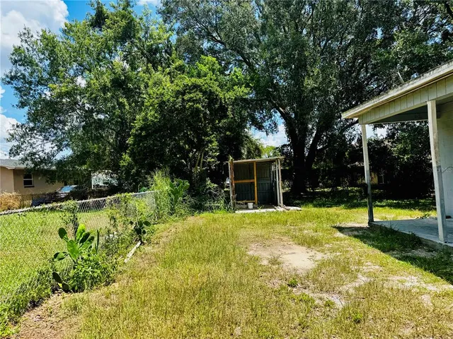 a house with trees in the background