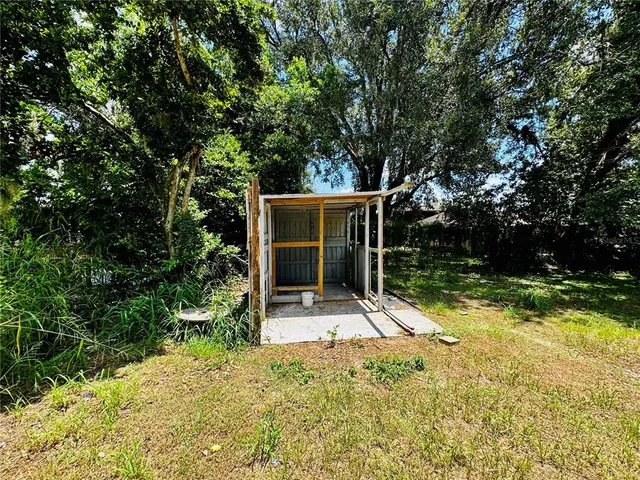 a house with trees in the background