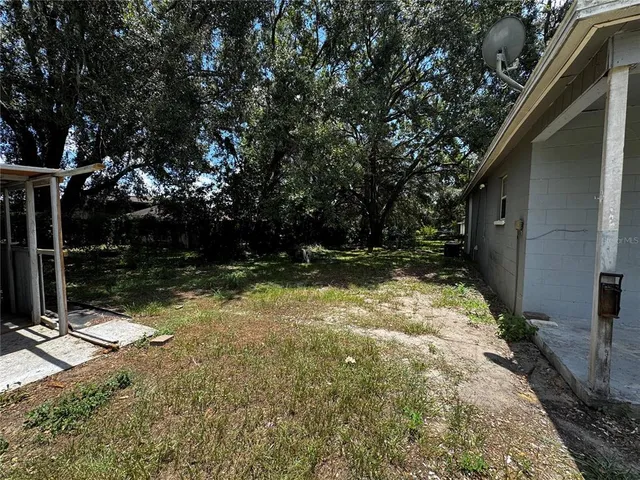 a backyard of a house with lots of green space