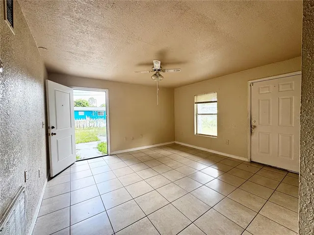a view of an empty room and window