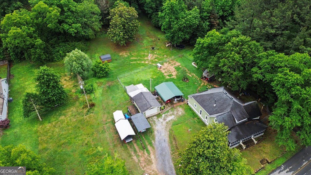 483 Coal Road Northwest Resaca, GA 30735 - Photo 54 of 56 an aerial view of a house with swimming pool and garden