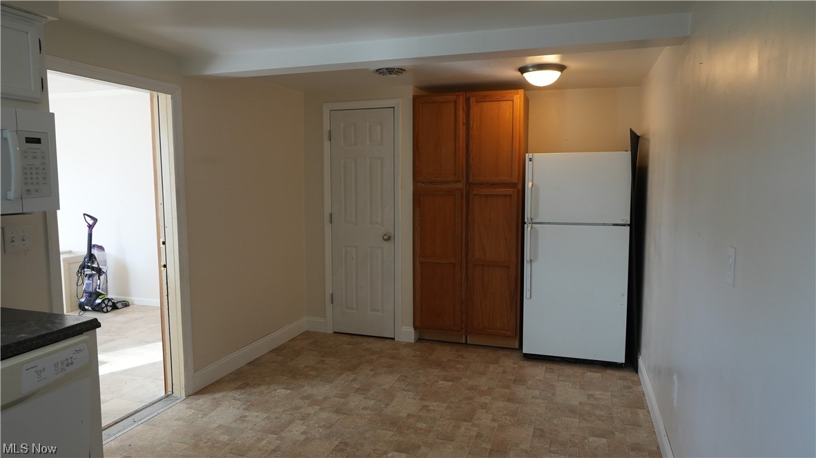 973 Archer Hill Road Colliers, WV 26035 - Photo 8 of 22 Kitchen featuring light tile flooring and white appliances