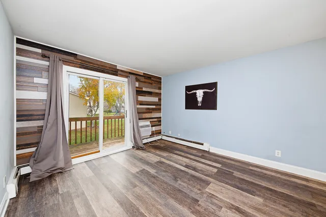 a view of an empty room with a window