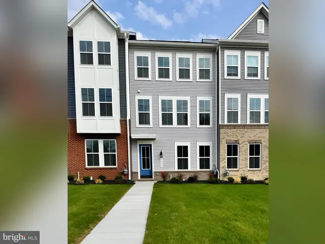 a big yard with large windows and a yard