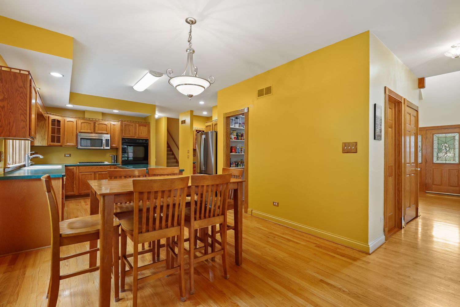3048 Brampton Lane Dyer, IN 46311 - Photo 15 of 46 a view of a dining area with furniture and wooden floor