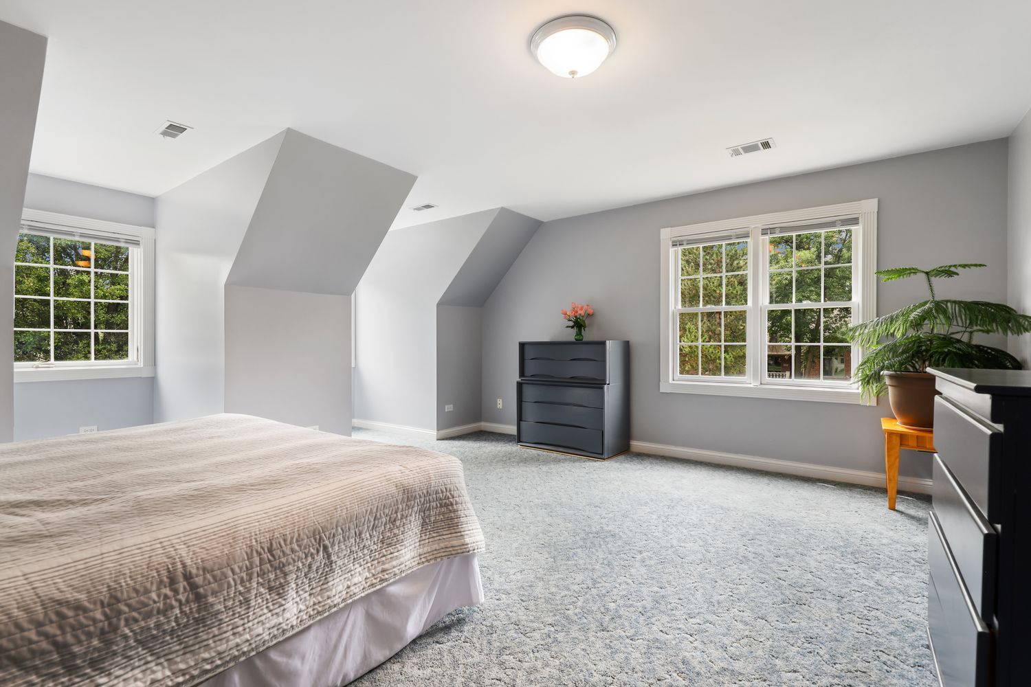 3048 Brampton Lane Dyer, IN 46311 - Photo 25 of 46 a spacious bedroom with a bed dresser and a large window