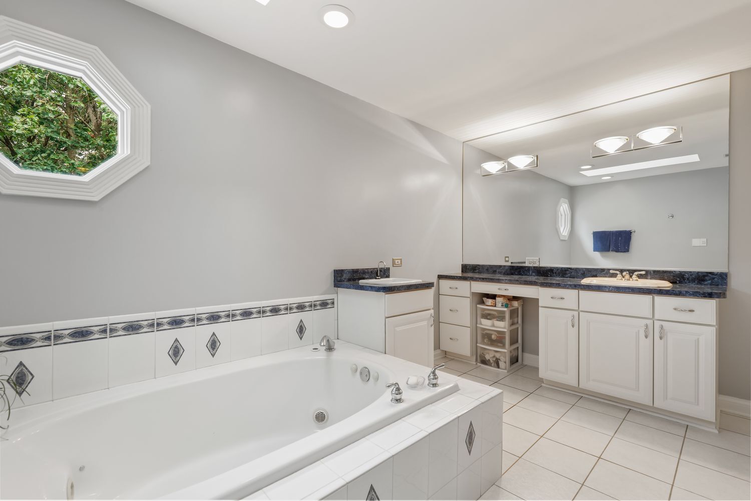 3048 Brampton Lane Dyer, IN 46311 - Photo 26 of 46 a bathroom with a bathtub sink and cabinets