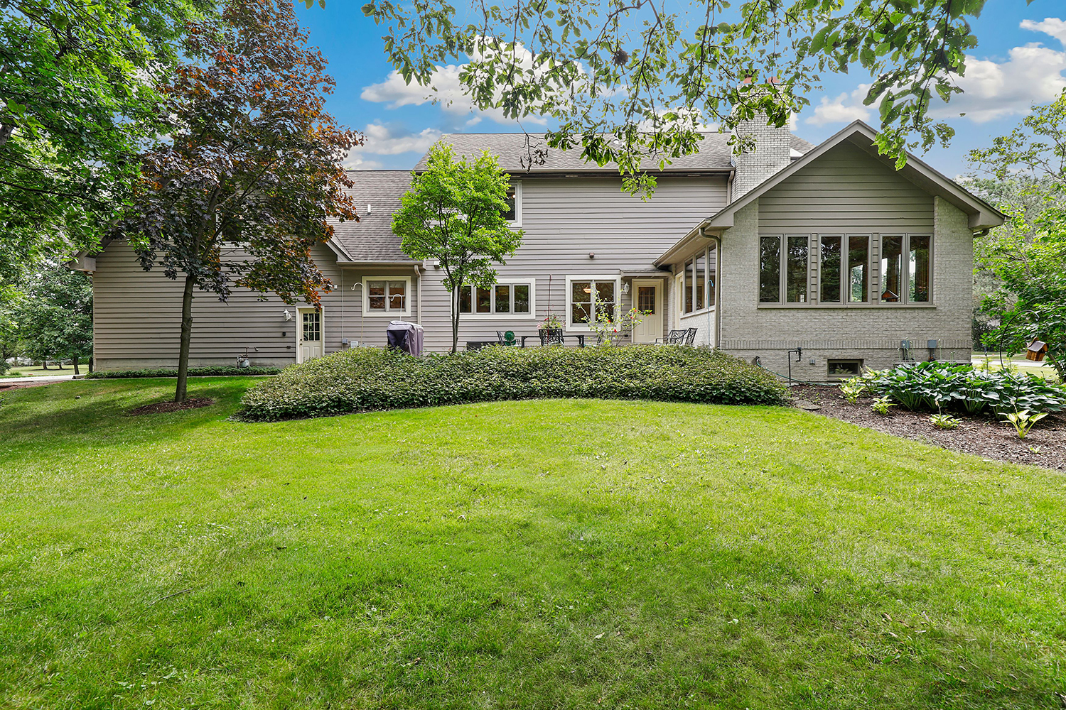 3048 Brampton Lane Dyer, IN 46311 - Photo 38 of 46 a front view of a house with a garden