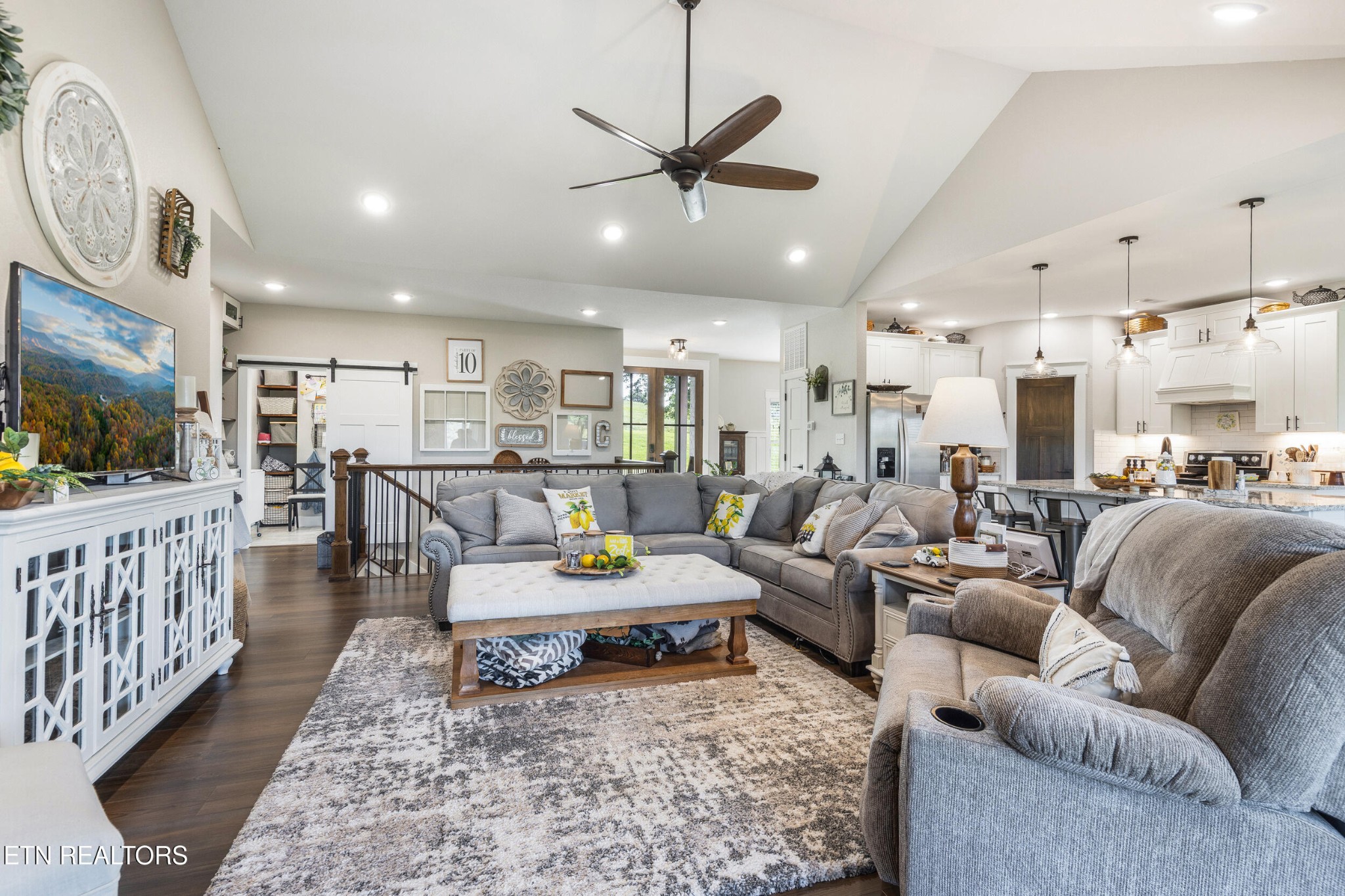 1866 Holston River Drive Rutledge, TN 37861 - Photo 12 of 54 a living room with furniture kitchen view and a flat screen tv
